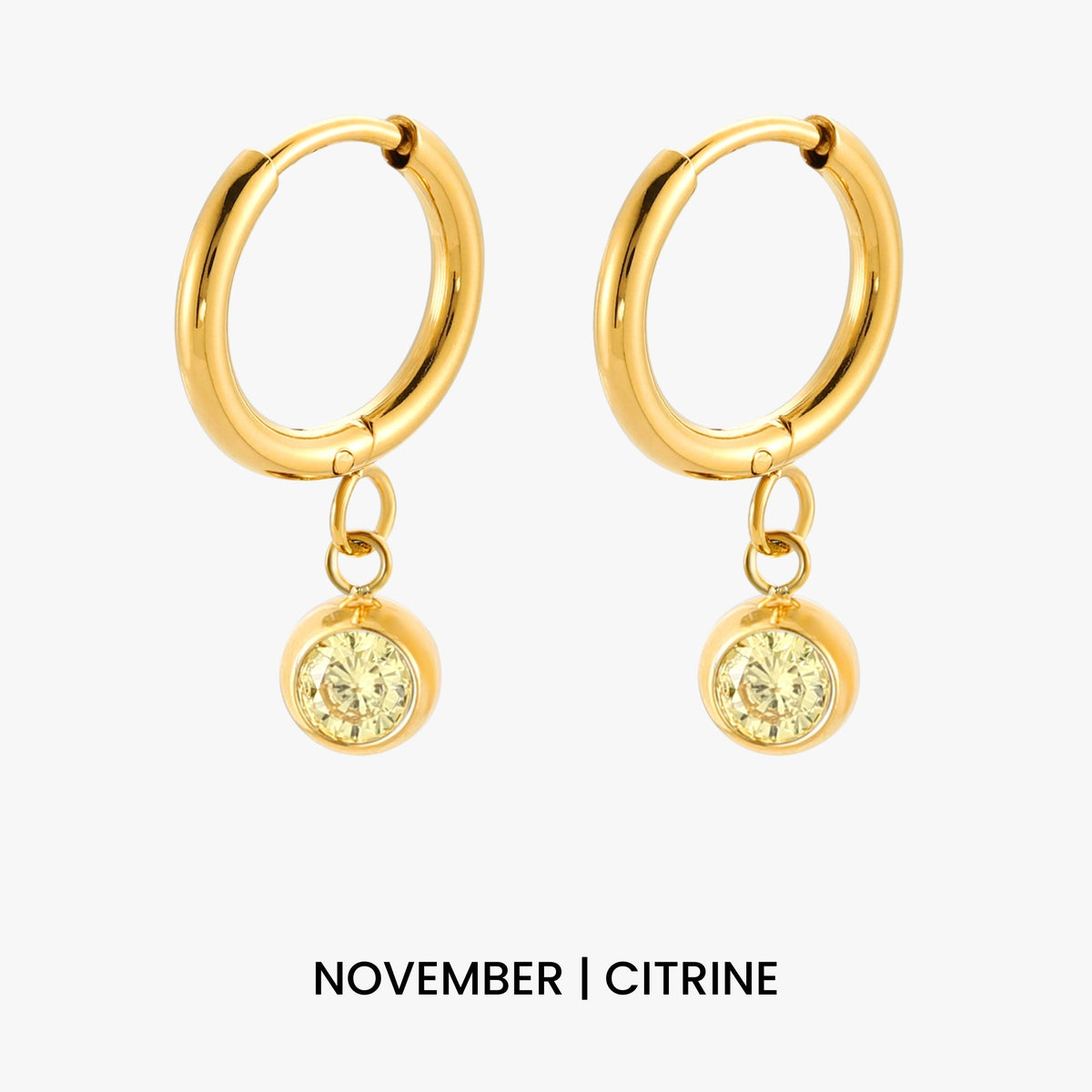 Aros con dije de piedra de nacimiento
