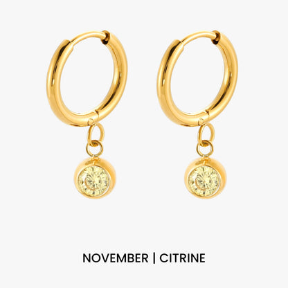 Aros con dije de piedra de nacimiento